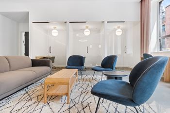 a living room filled with furniture and a large window