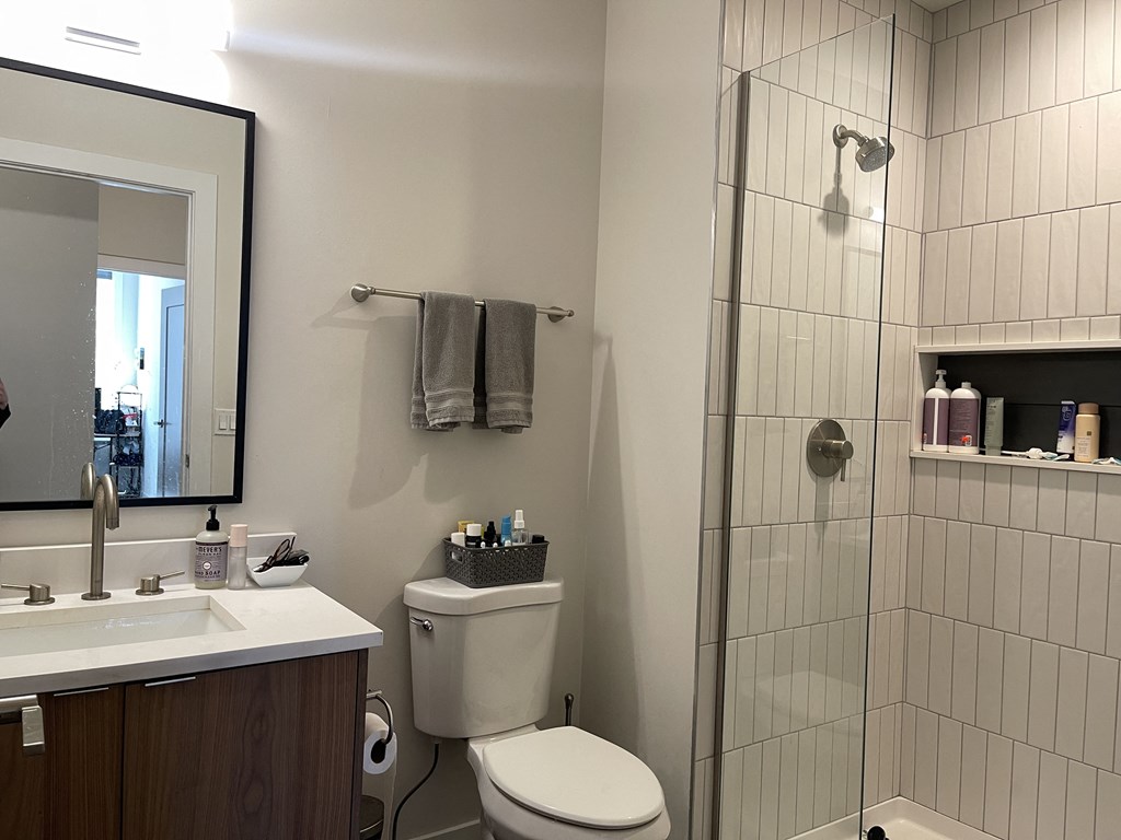 a small bathroom with a toilet sink and shower