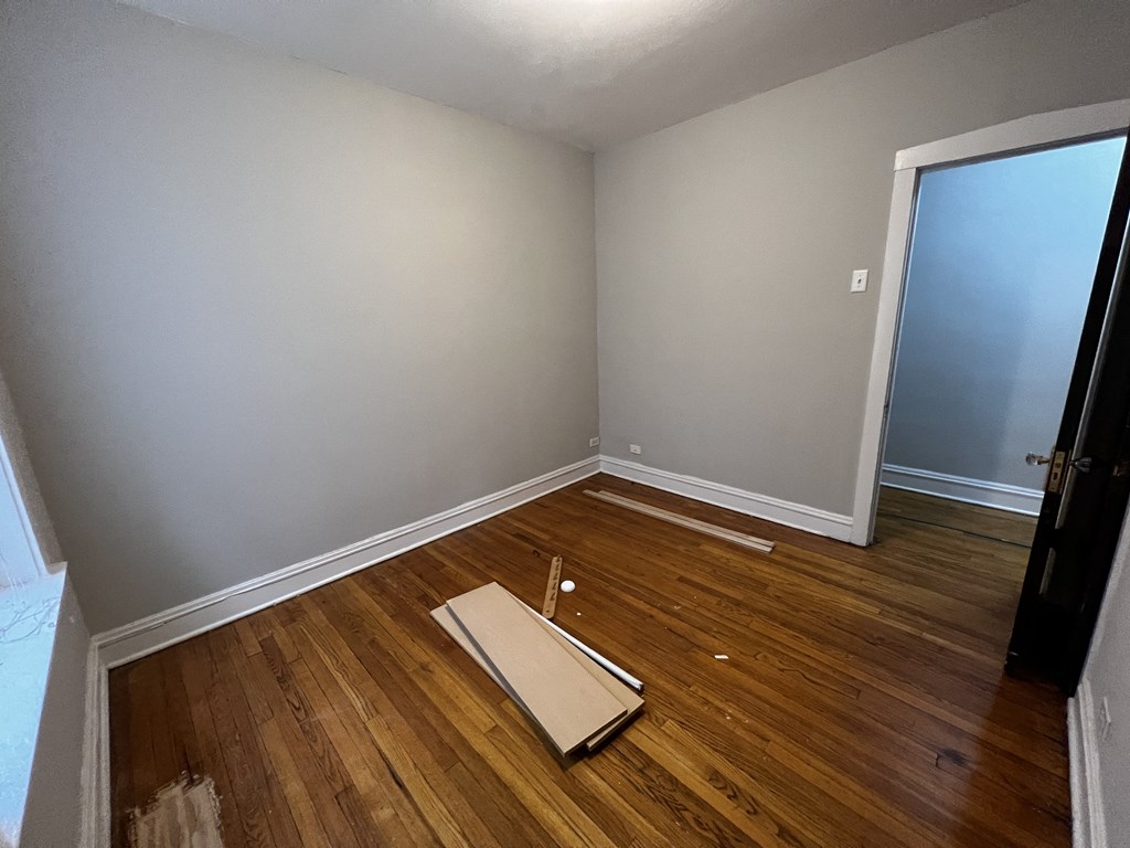 an empty room with a piece of cardboard on the floor
