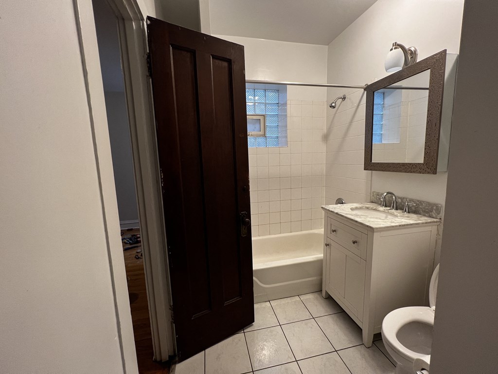 a bathroom with a sink toilet and bathtub