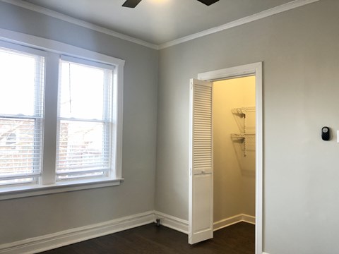 A room with a window and a door.