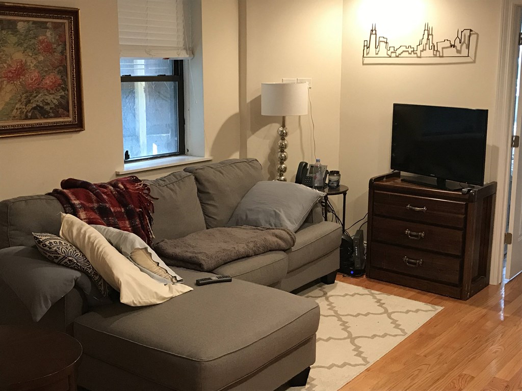 a living room with a couch and a tv