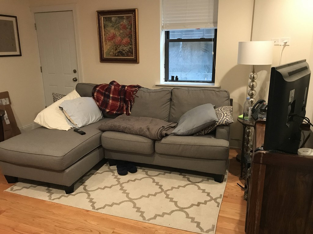 a living room with a couch and a tv