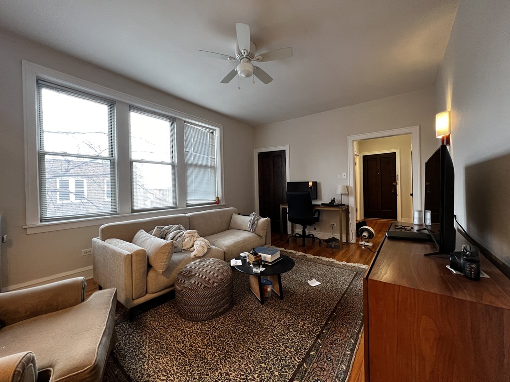 a living room with a couch and a tv