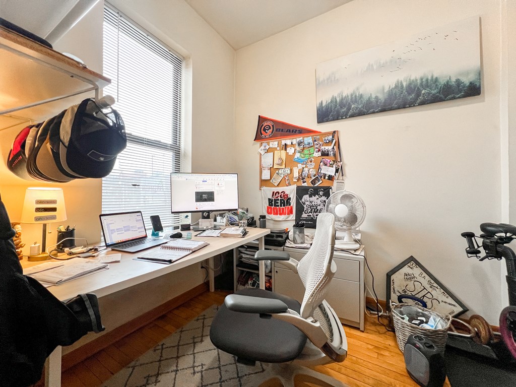 a home office with a desk and a computer