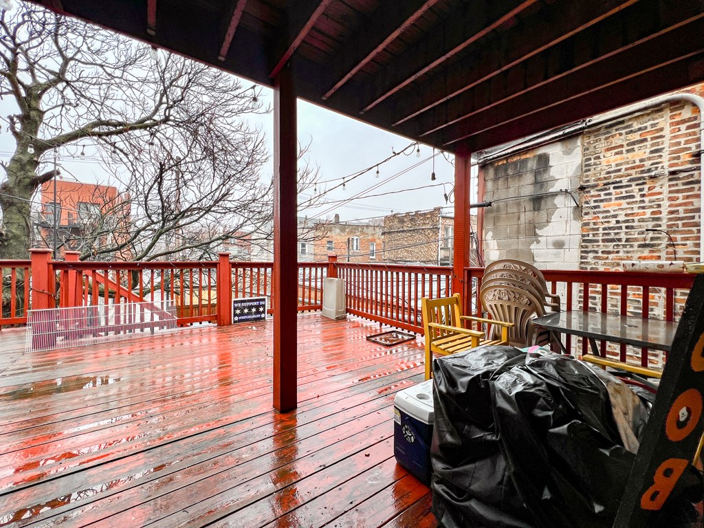 the deck of a house with rain on it