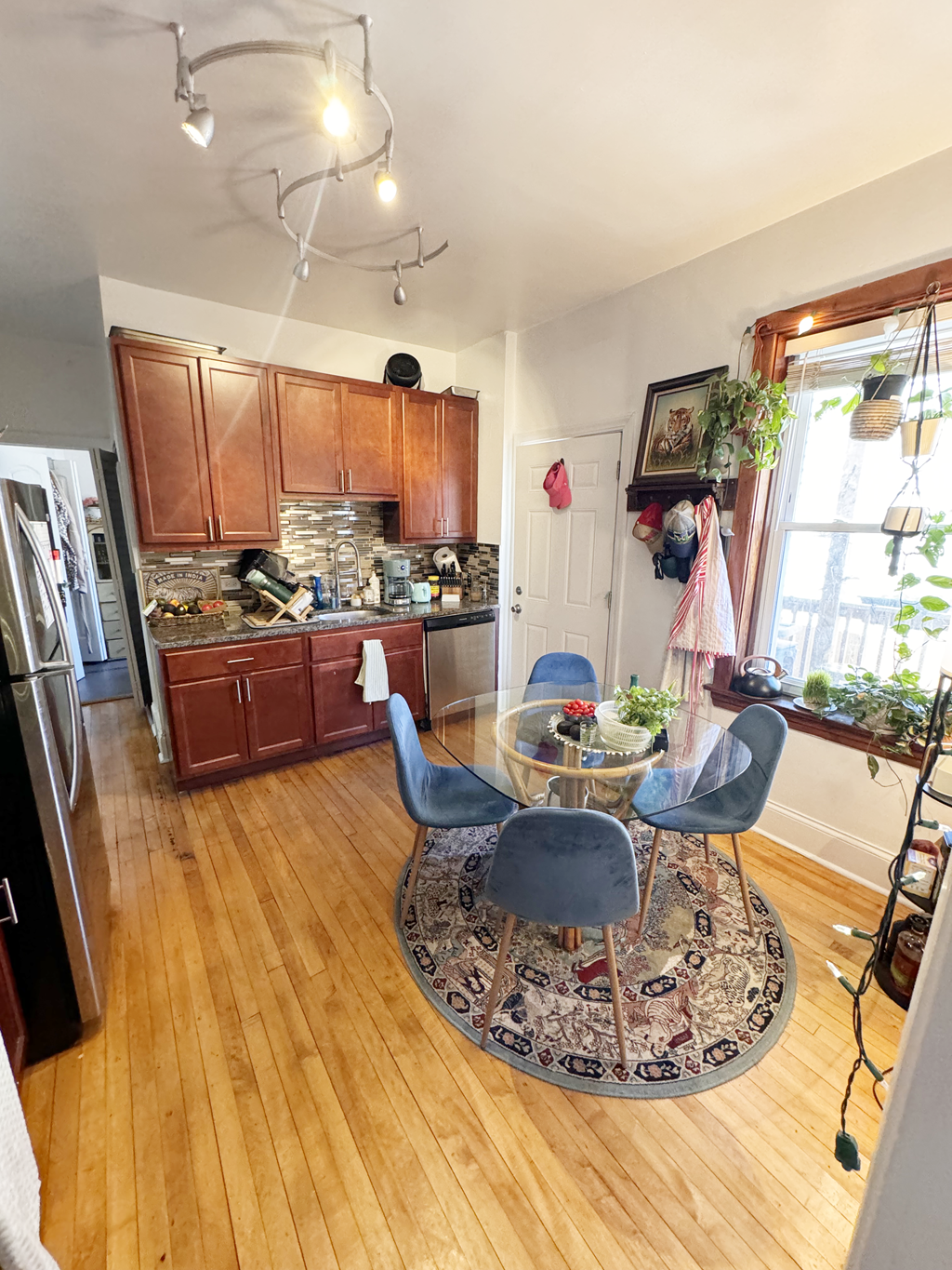 a kitchen and dining room with a table and chairs