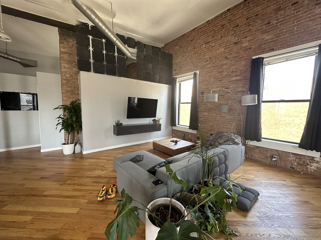 a living room with a couch and a tv in it
