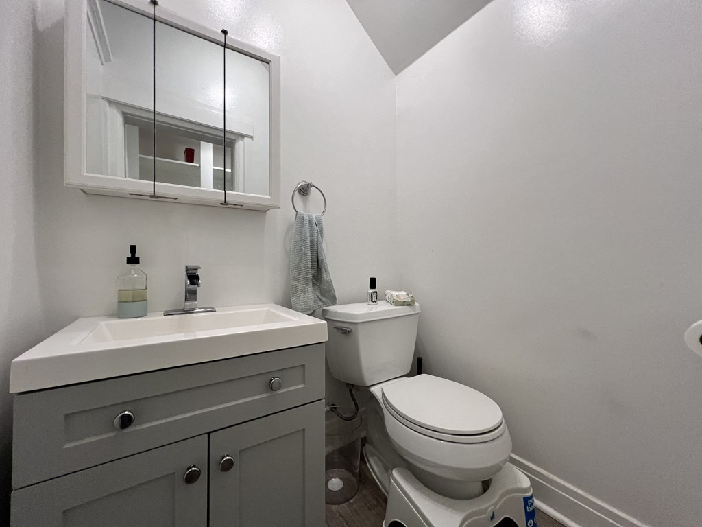 an empty bathroom with a toilet and a sink