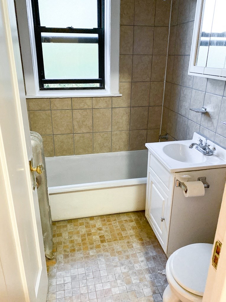 a bathroom with a sink toilet and a bath tub