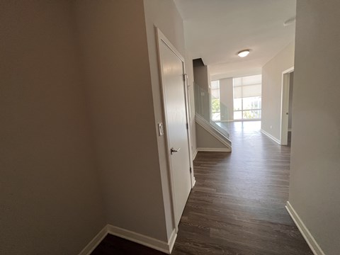 a view from the living room into the hallway of a new home