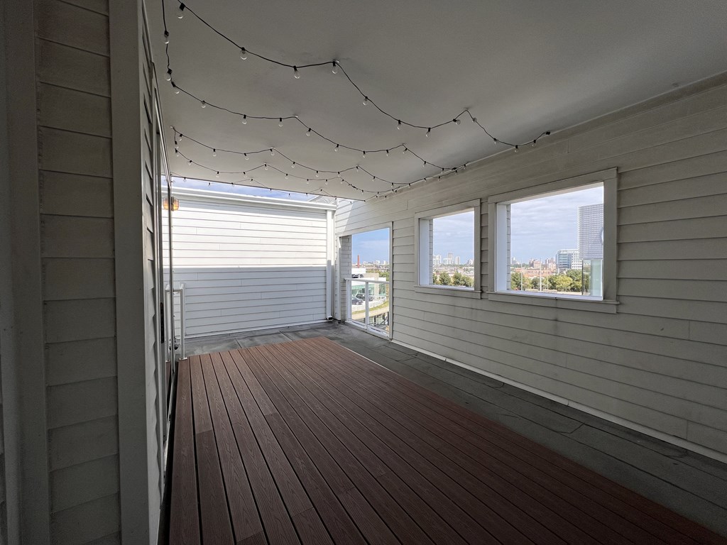 the upstairs balcony has views of the city and the ocean