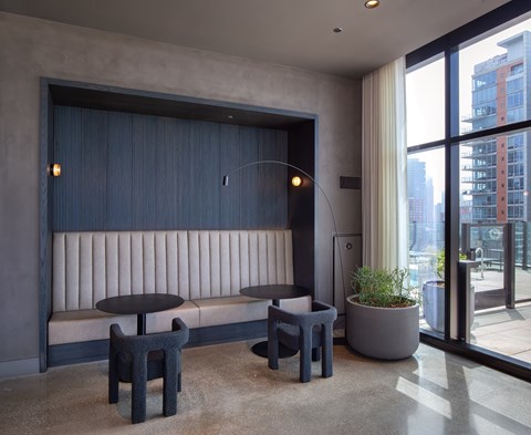 A modern cafe with a view of the city.