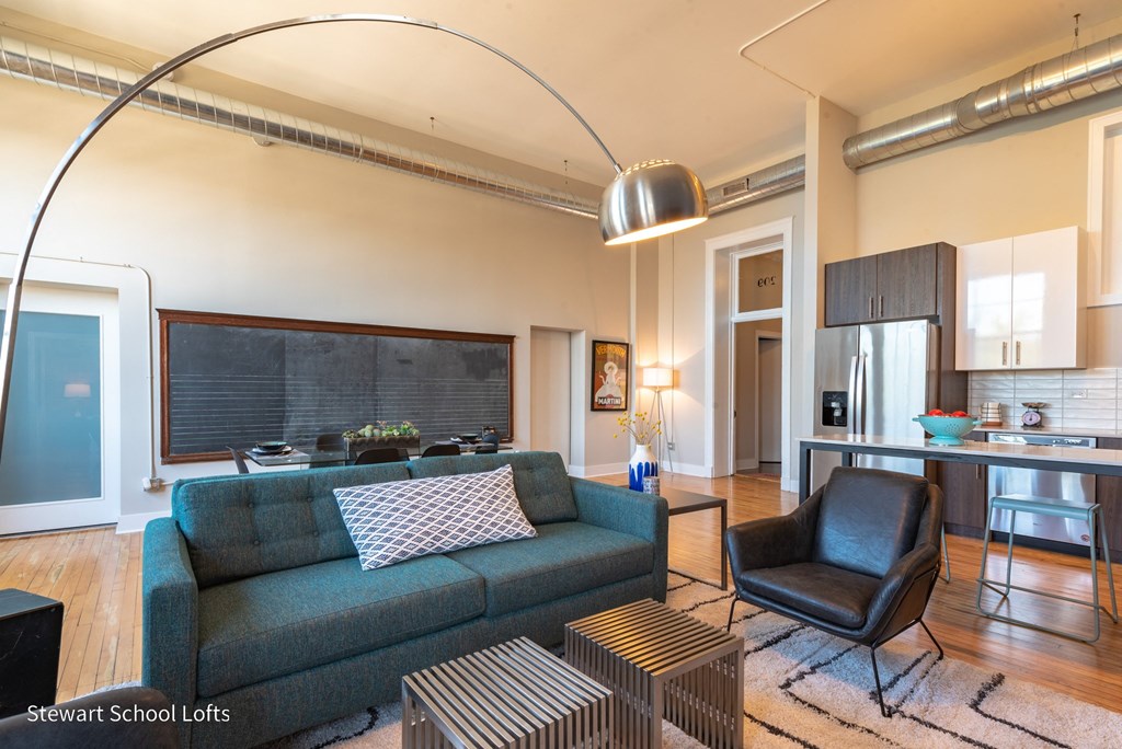 a living room with a blue couch and a coffee table