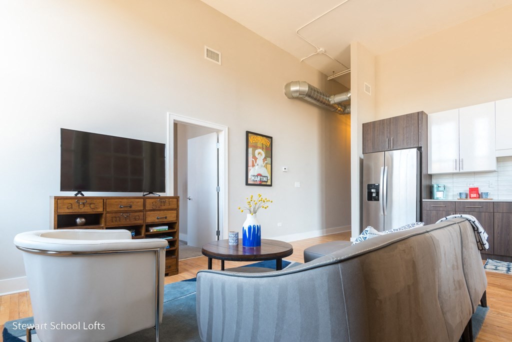 a living room with a couch and a tv