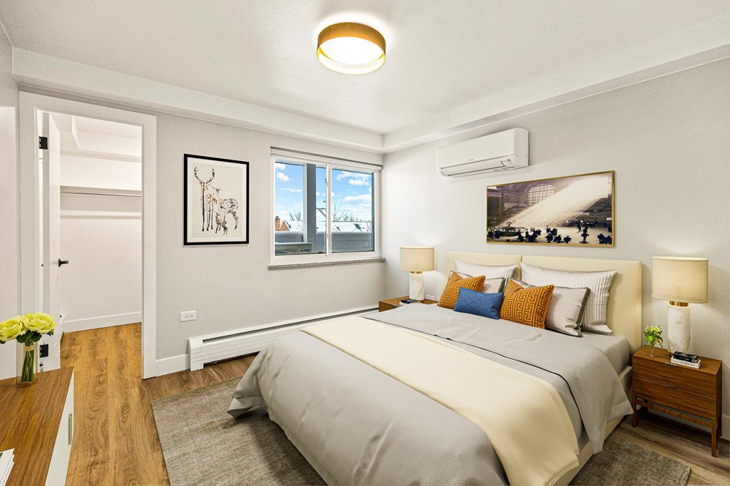 a bedroom with a bed and a window