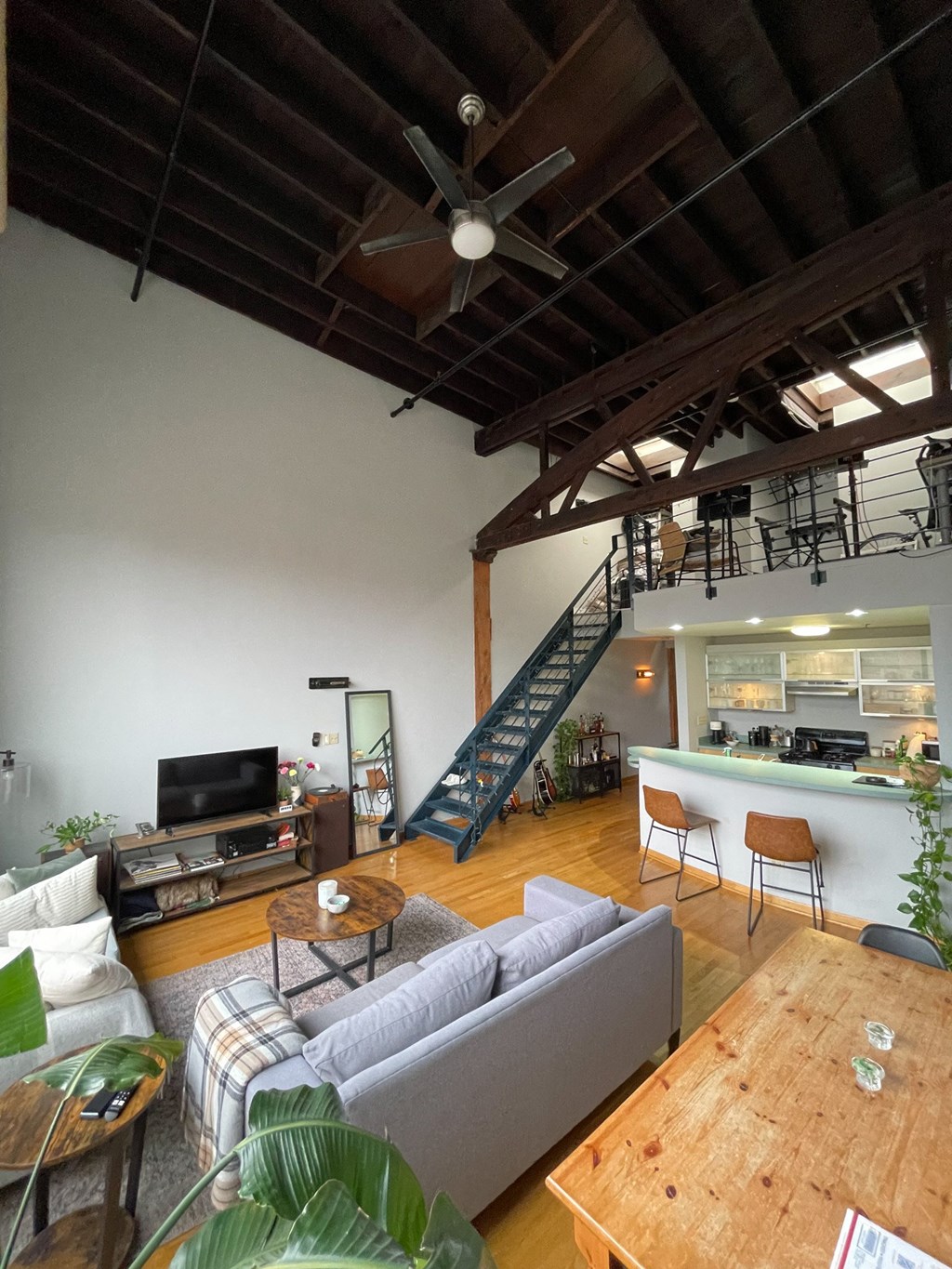 a view of the living room and dining room from the loft