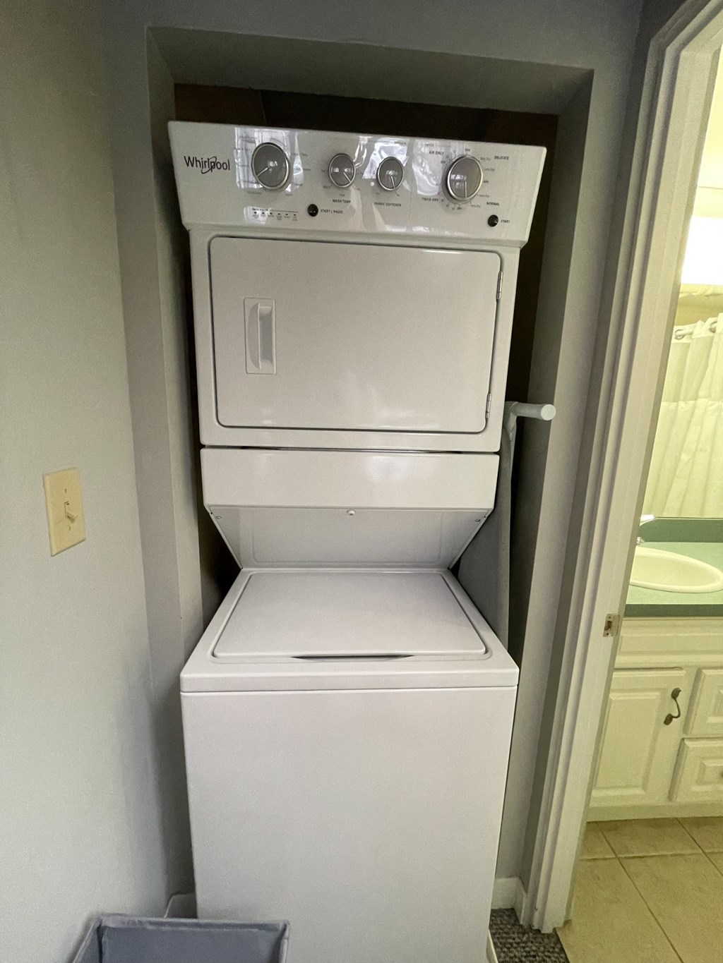 a washer and dryer in a closet in a bathroom