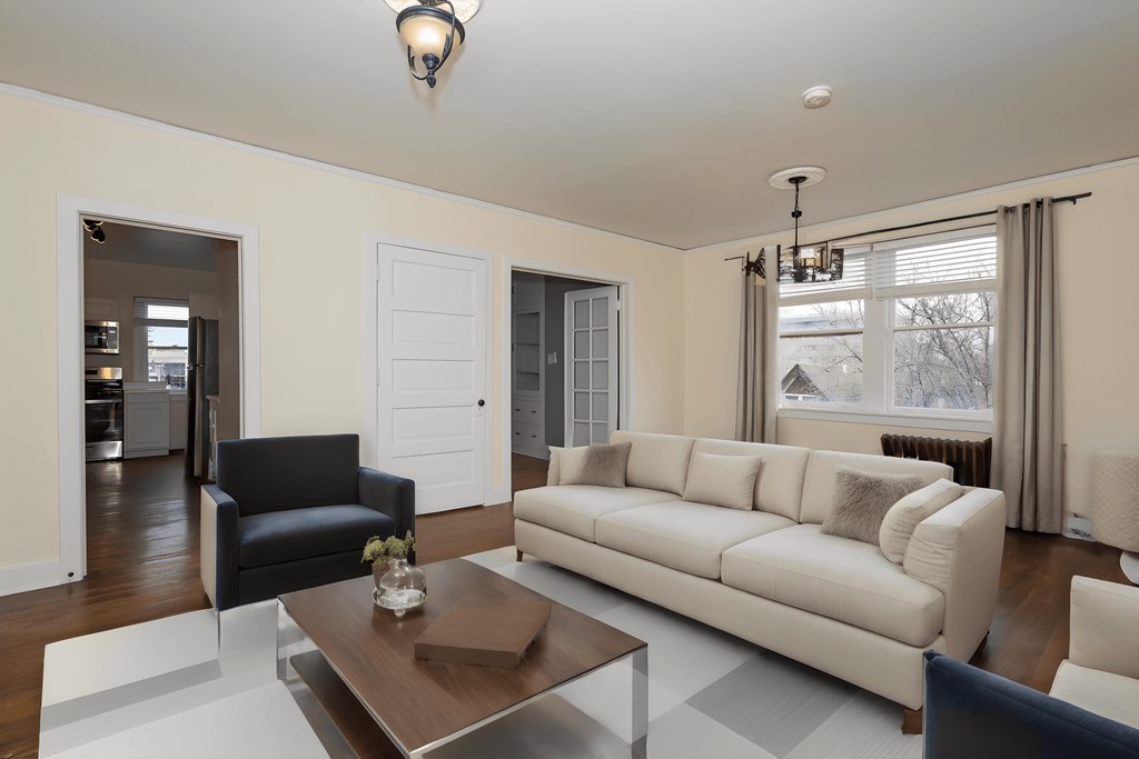 a living room with a white couch and a coffee table