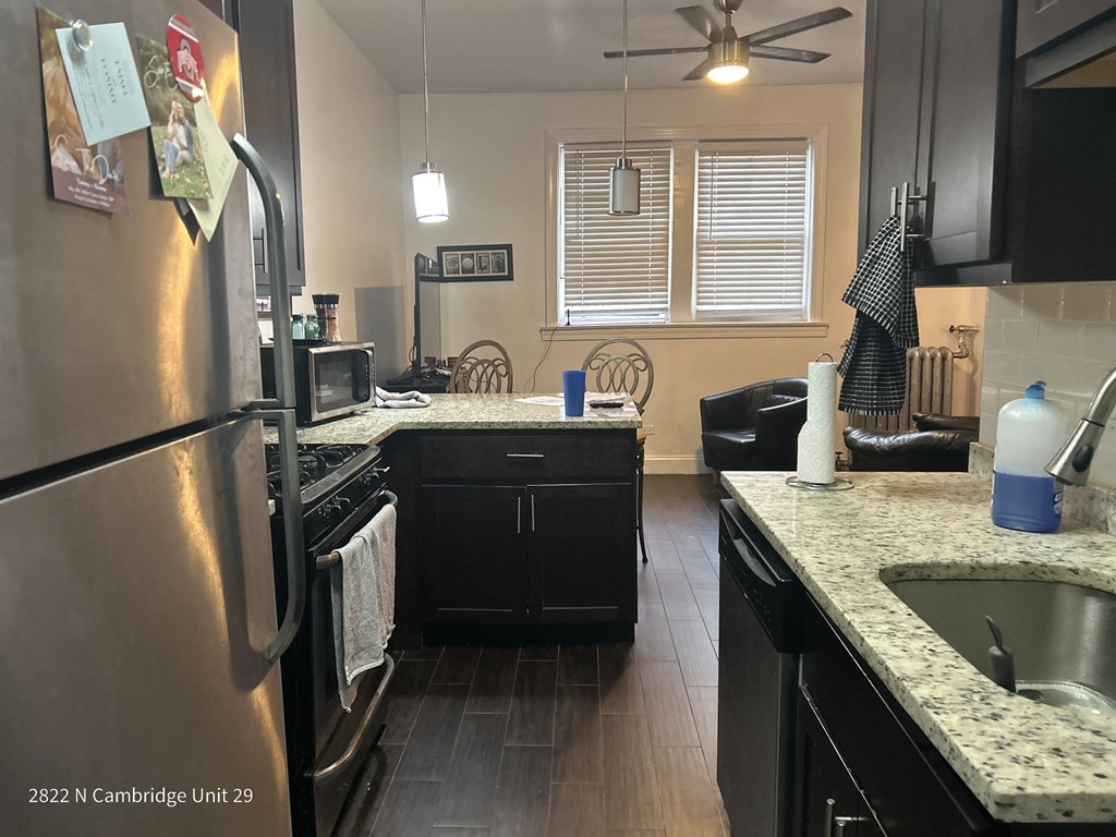 a kitchen with stainless steel appliances and granite counter tops