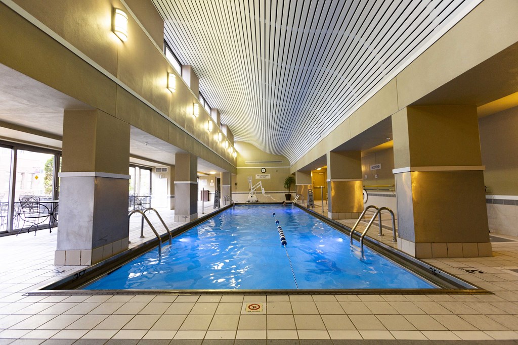 a swimming pool in the middle of a hotel lobby