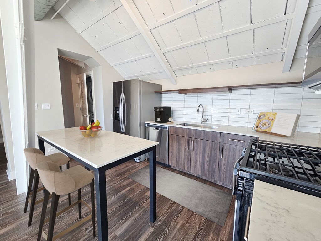 a view from the second floor of a building with a counter top and a staircase