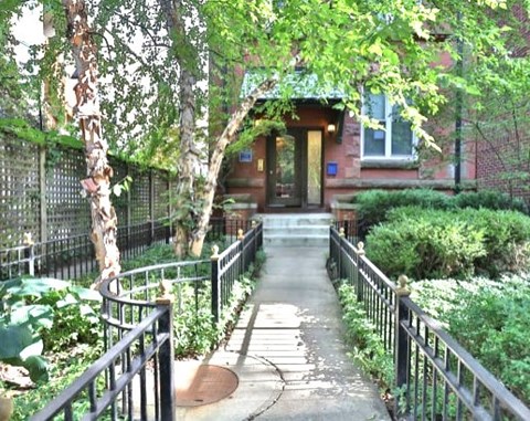 a walkway in front of a house