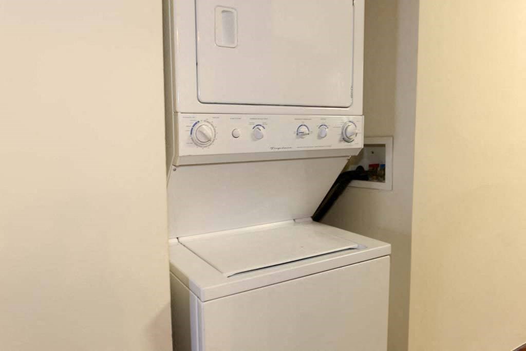 a white washer and dryer in a room