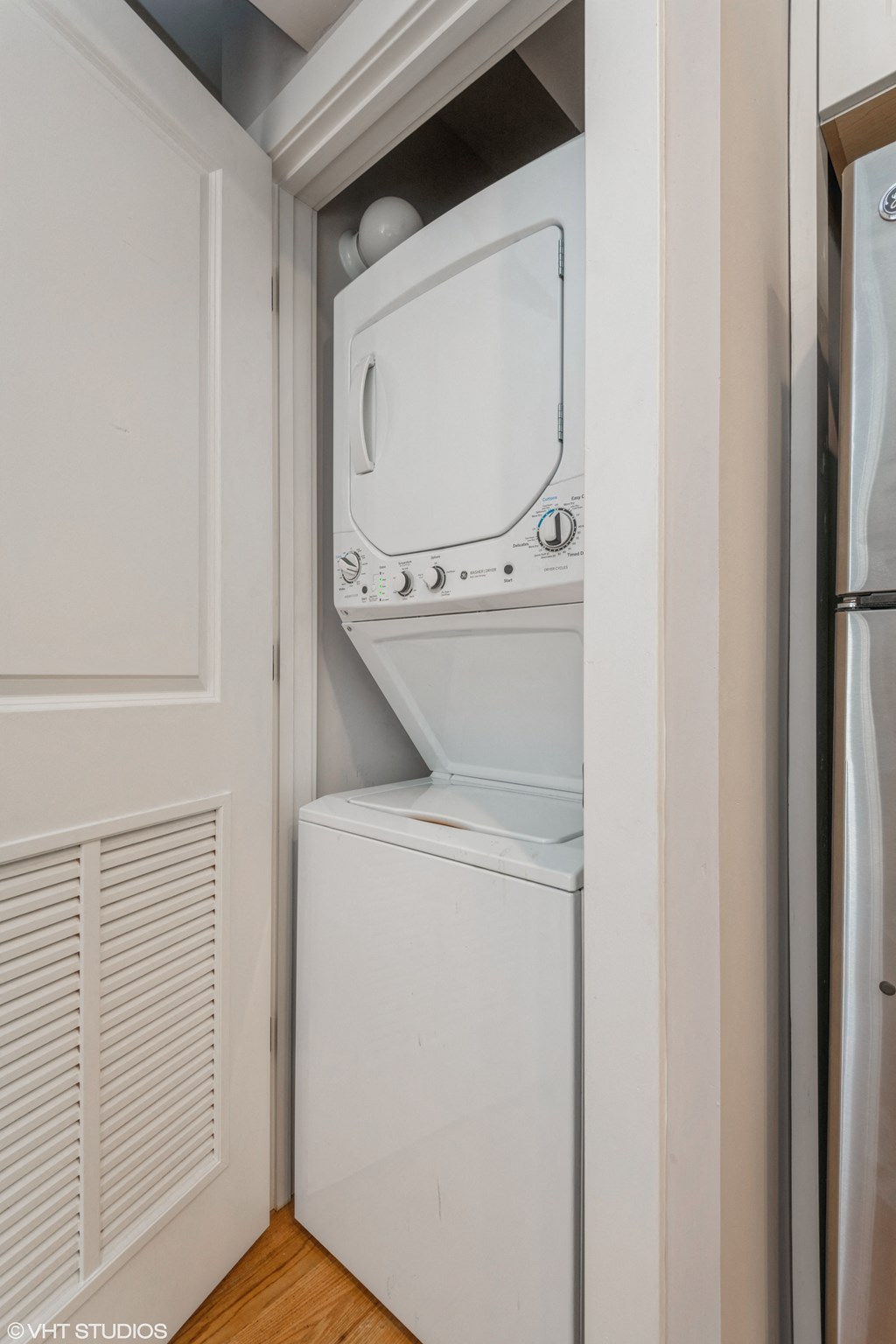 a small laundry room with a washer and dryer
