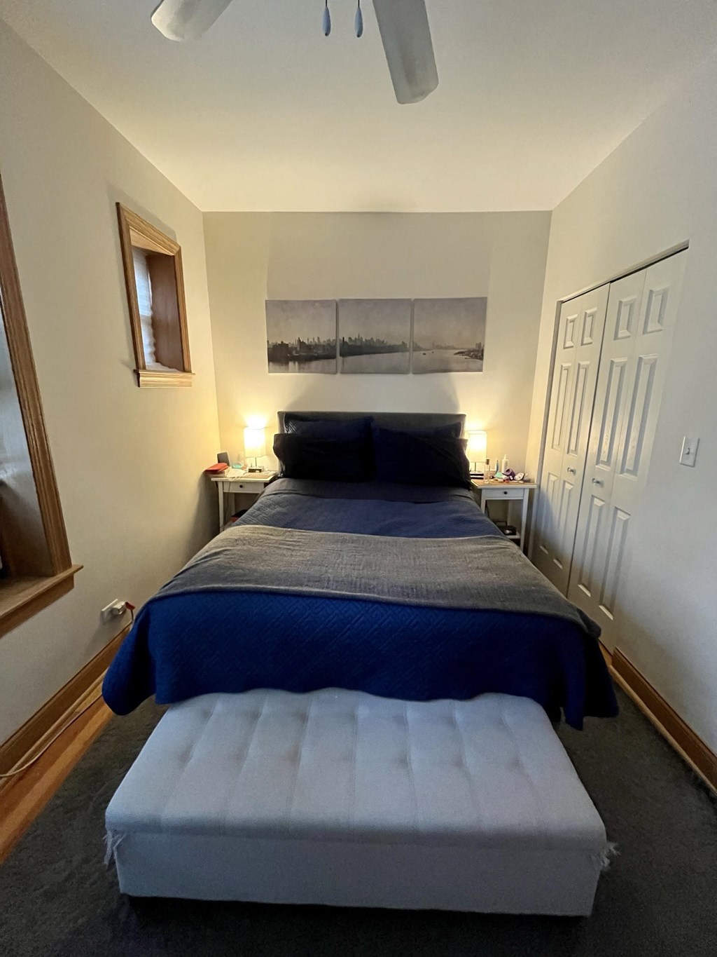 a bedroom with a bed and a blue blanket