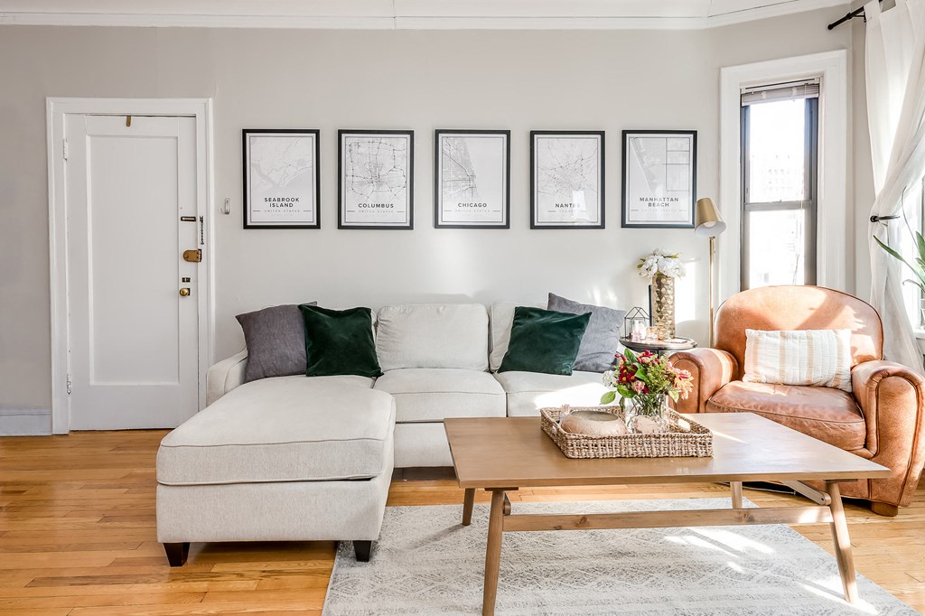 a living room with a white couch and a coffee table