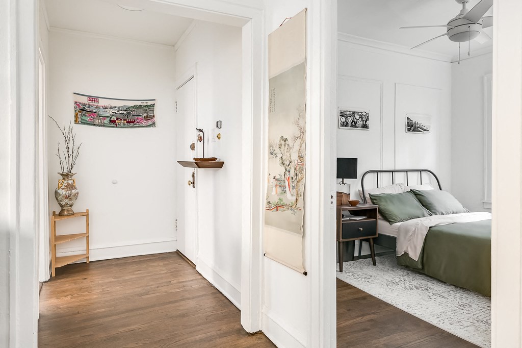 a bedroom with a bed and a closet  and a mirror