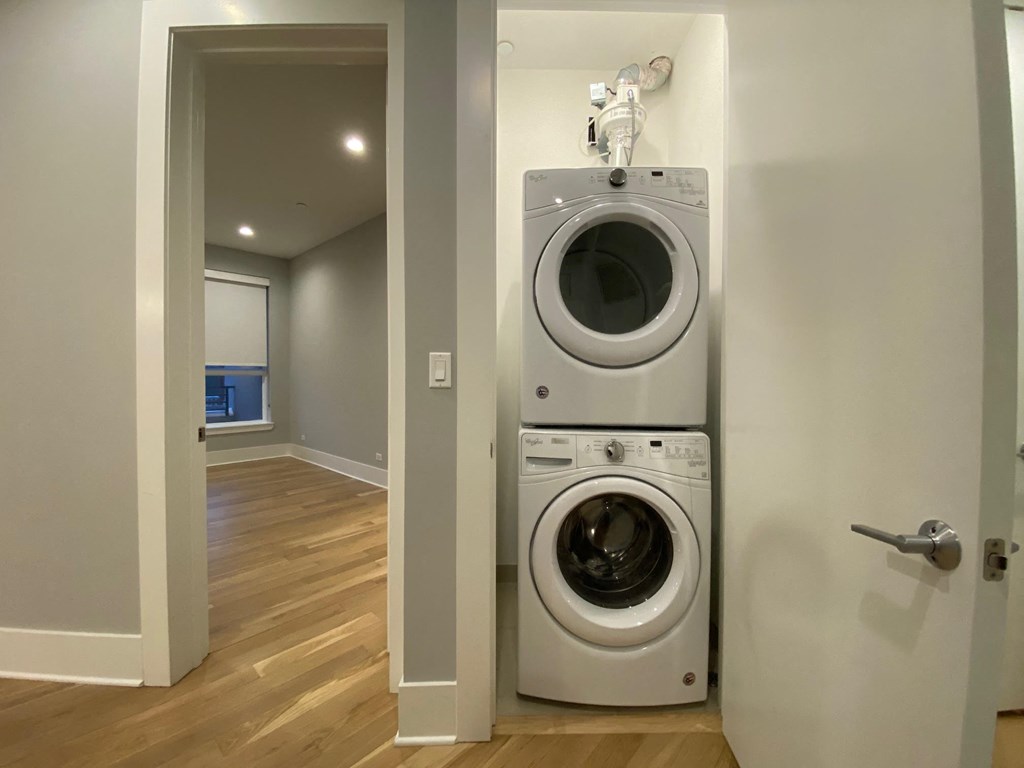 a front loading washer and dryer in a laundry room