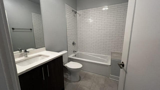 a bathroom with a toilet and a sink and a tub