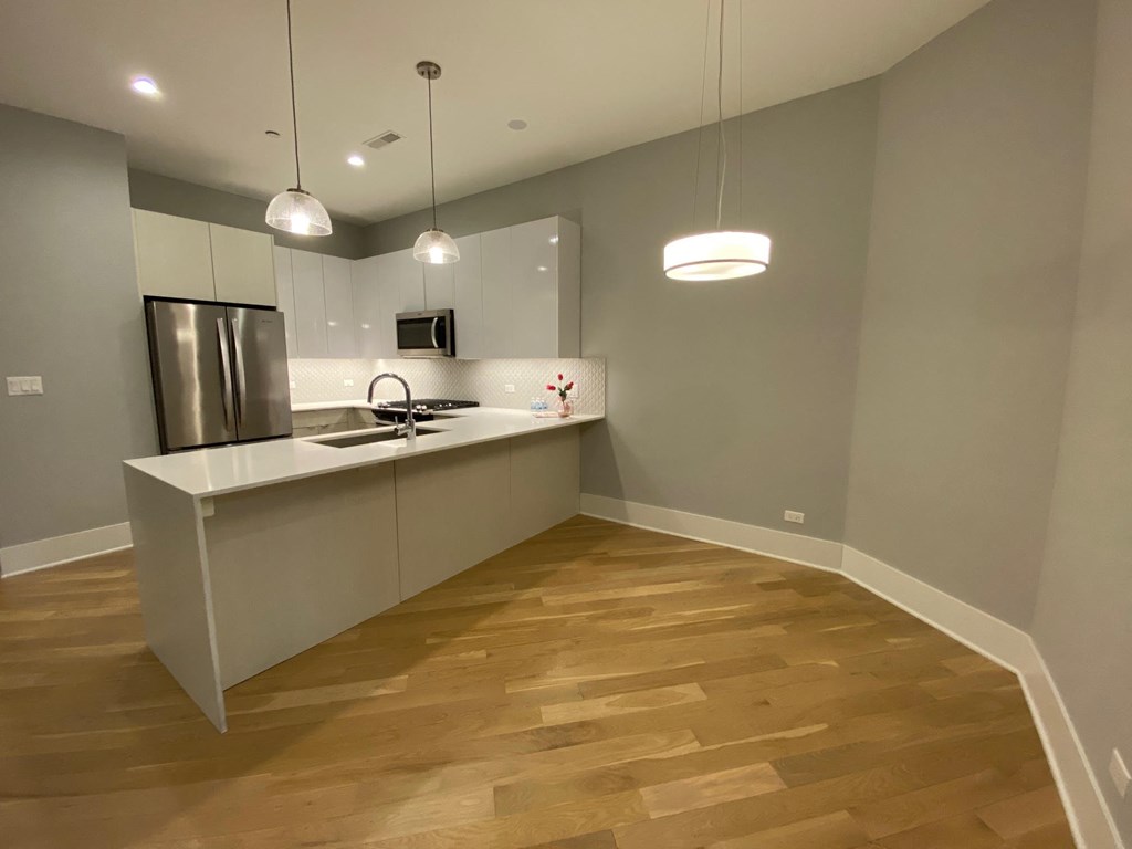 a kitchen with a sink and a counter top in a house