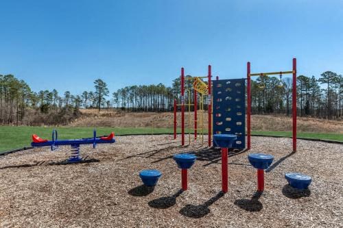 a playground with a swing set and other playground equipment