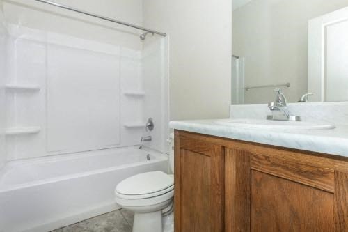 a white bathroom with a toilet and a sink