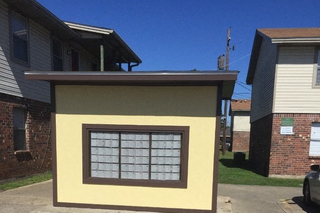 a yellow house with a window on the side of it