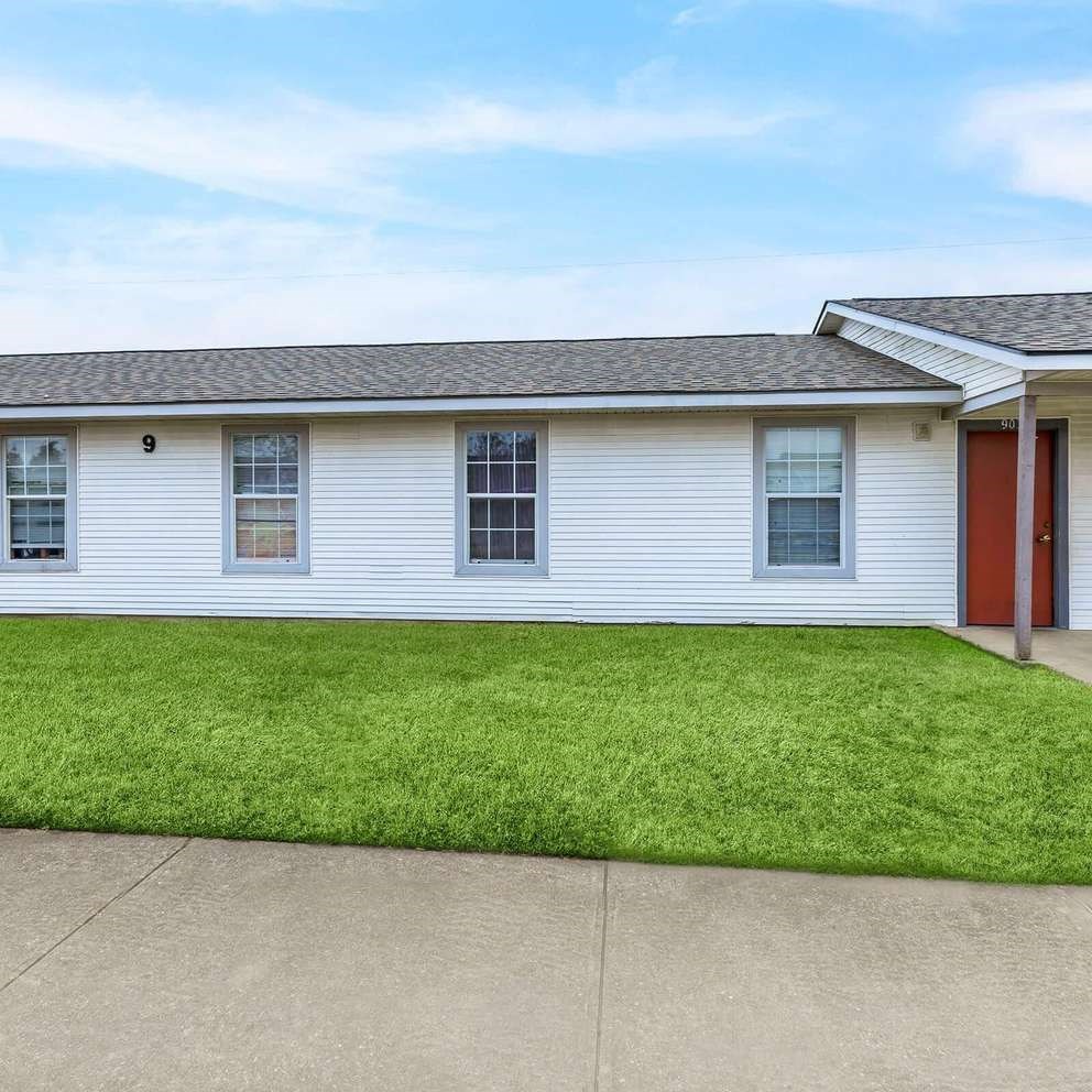 A house with a red door is numbered 9.