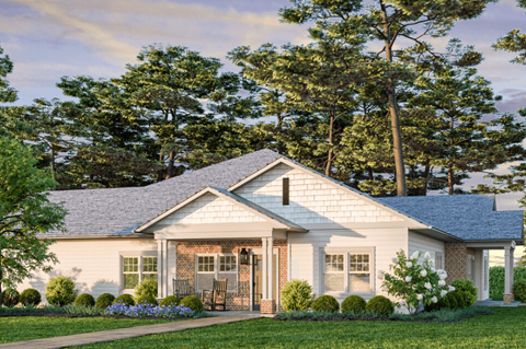 a white house with a gray roof and a lawn