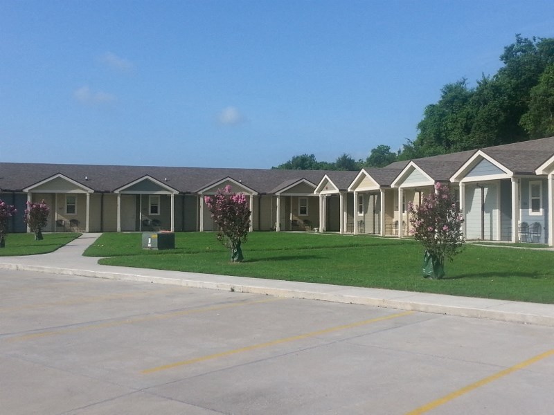 a row of houses on the side of a street
