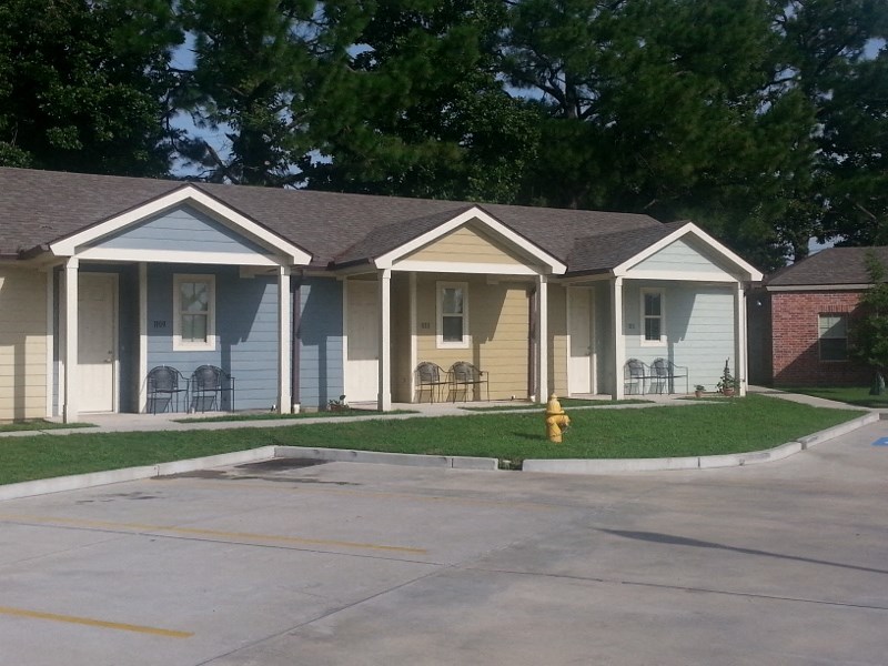 a row of houses in a neighborhood with a yellow fire hydrant