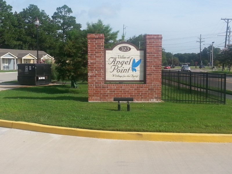 the sign for the archer bank sign in front of a brick wall
