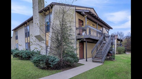 A building with a staircase leading to the second floor.
