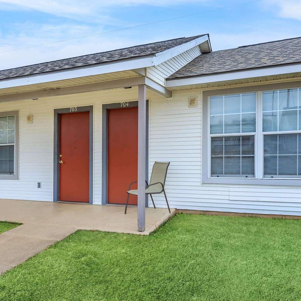 A house with the number 703 and 704 on the doors.