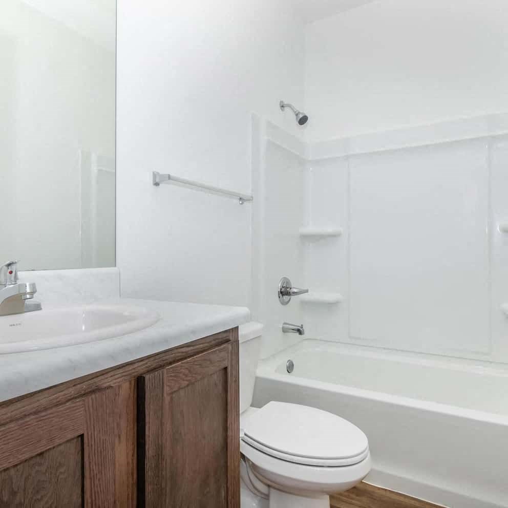 a bathroom with a sink toilet and a bath tub