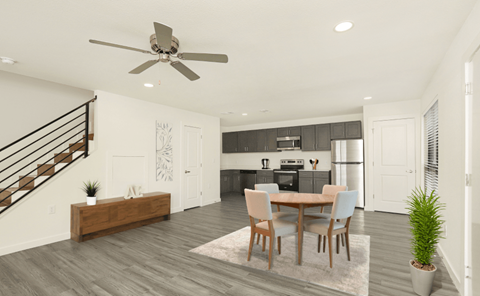 A modern dining room with a wooden table and chairs.
