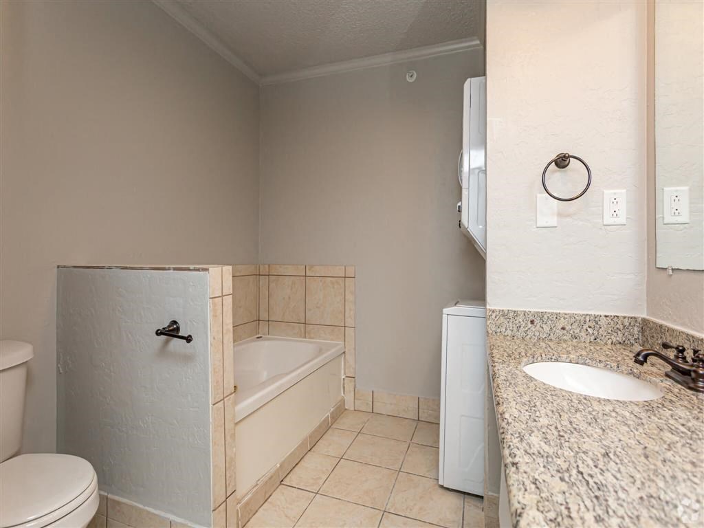 a bathroom with a sink toilet and a bath tub