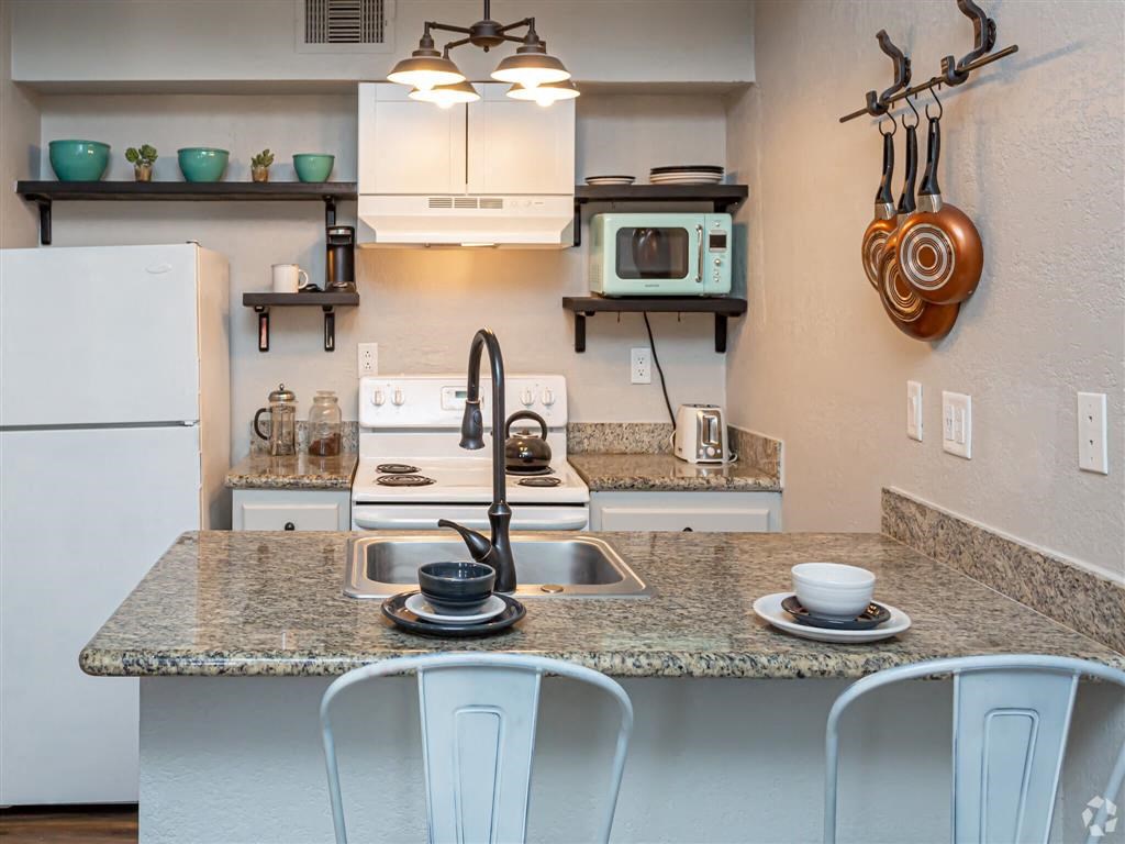 a kitchen with a counter top and a sink