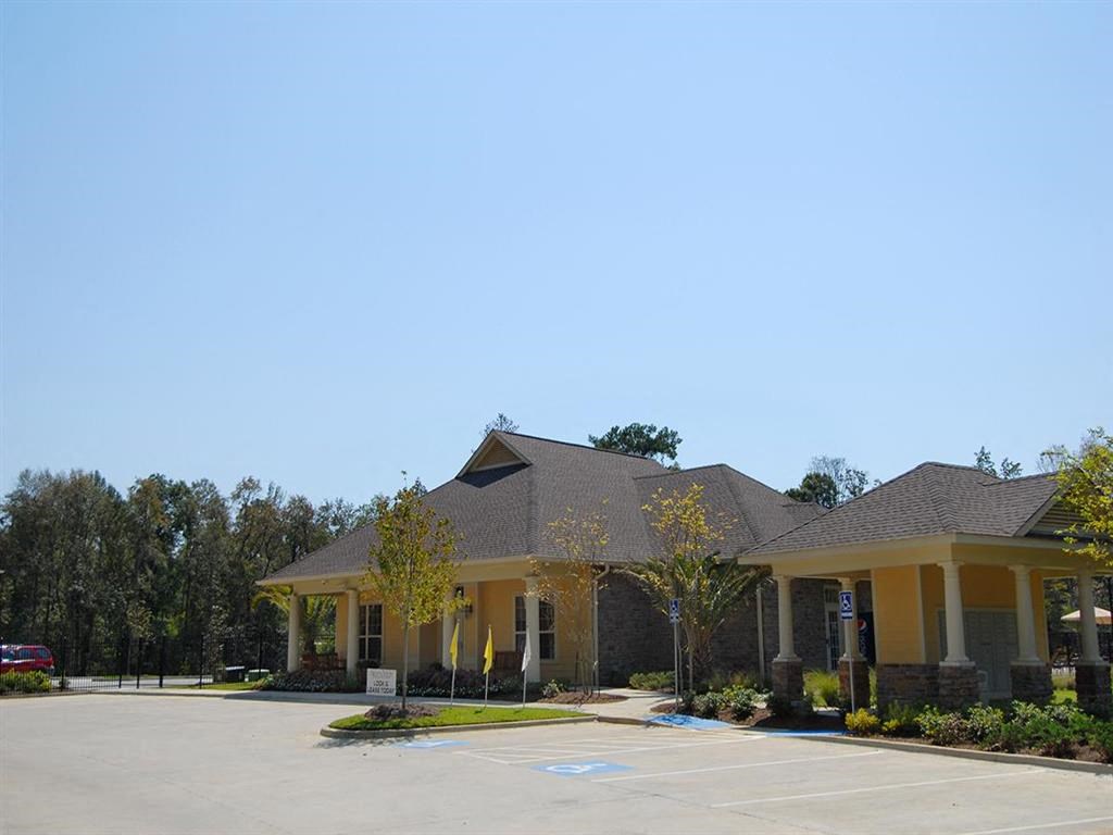 a house with a parking lot in front of it